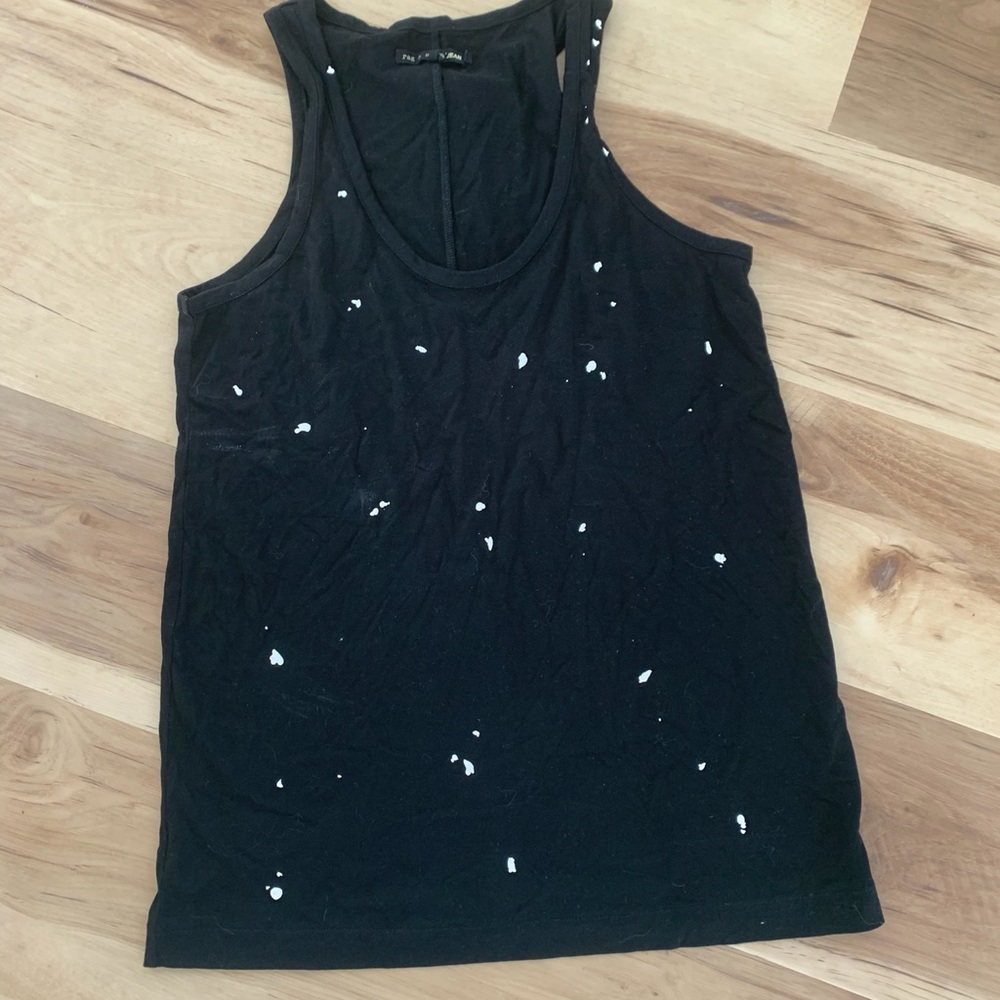A black silky tank top with specks of white